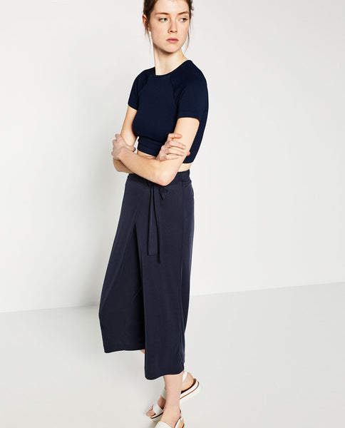 CROPPED CROSSOVER TROUSERS